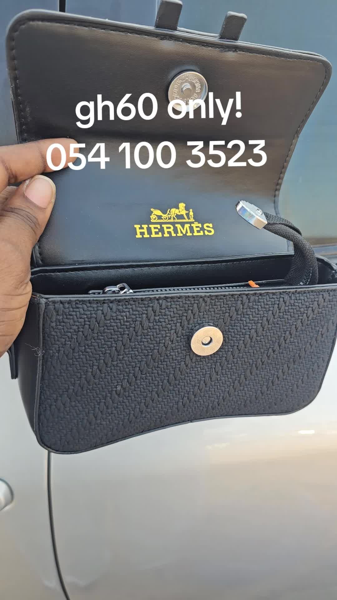 Hermès Inspired Woven Handbag - Sleek black handbag with textured woven body, magnetic snap closure, internal gold branding, and structured rectangular boxy shape with sturdy top handle