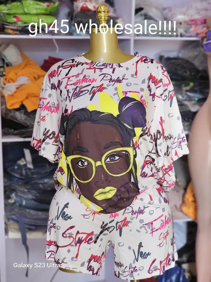 Urban Muse Graffiti Graphic Set - Cream/off-white oversized drop-shoulder tee and matching relaxed-fit shorts with large stylized female portrait graphic featuring yellow-framed glasses and neon lip detail, surrounded by red and black script graffiti text