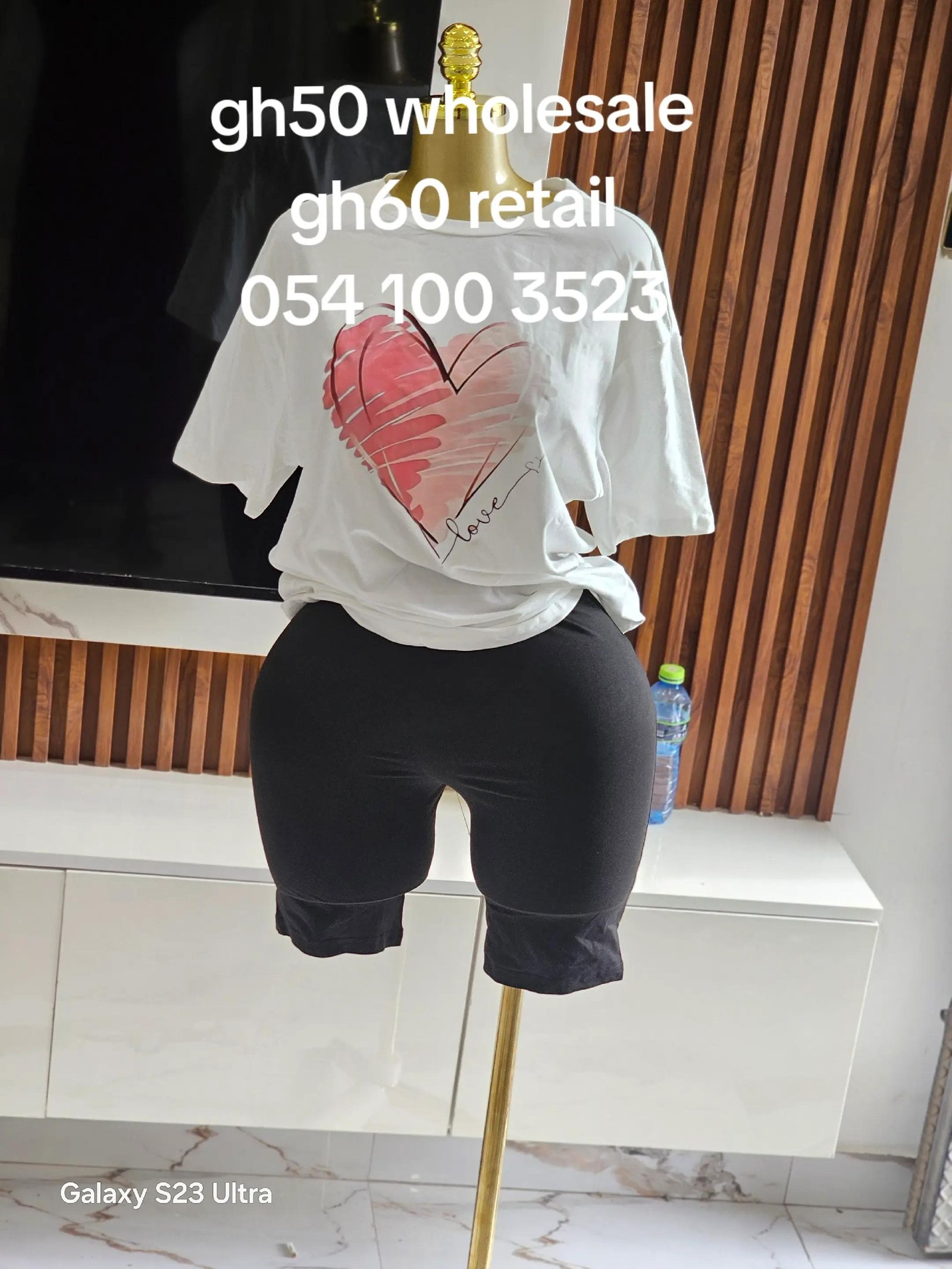 White Heart Lounge Set - Oversized white crewneck t-shirt with pink watercolor heart graphic and 'Love' script text, paired with solid black mid-thigh biker shorts with body-hugging elastic fit